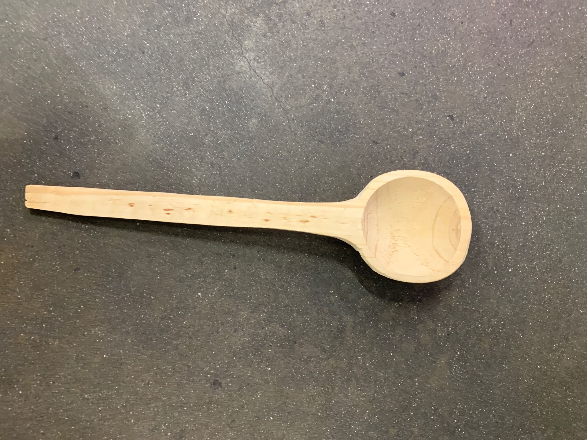 Wood spoon. Roughly measures 12 inches in length