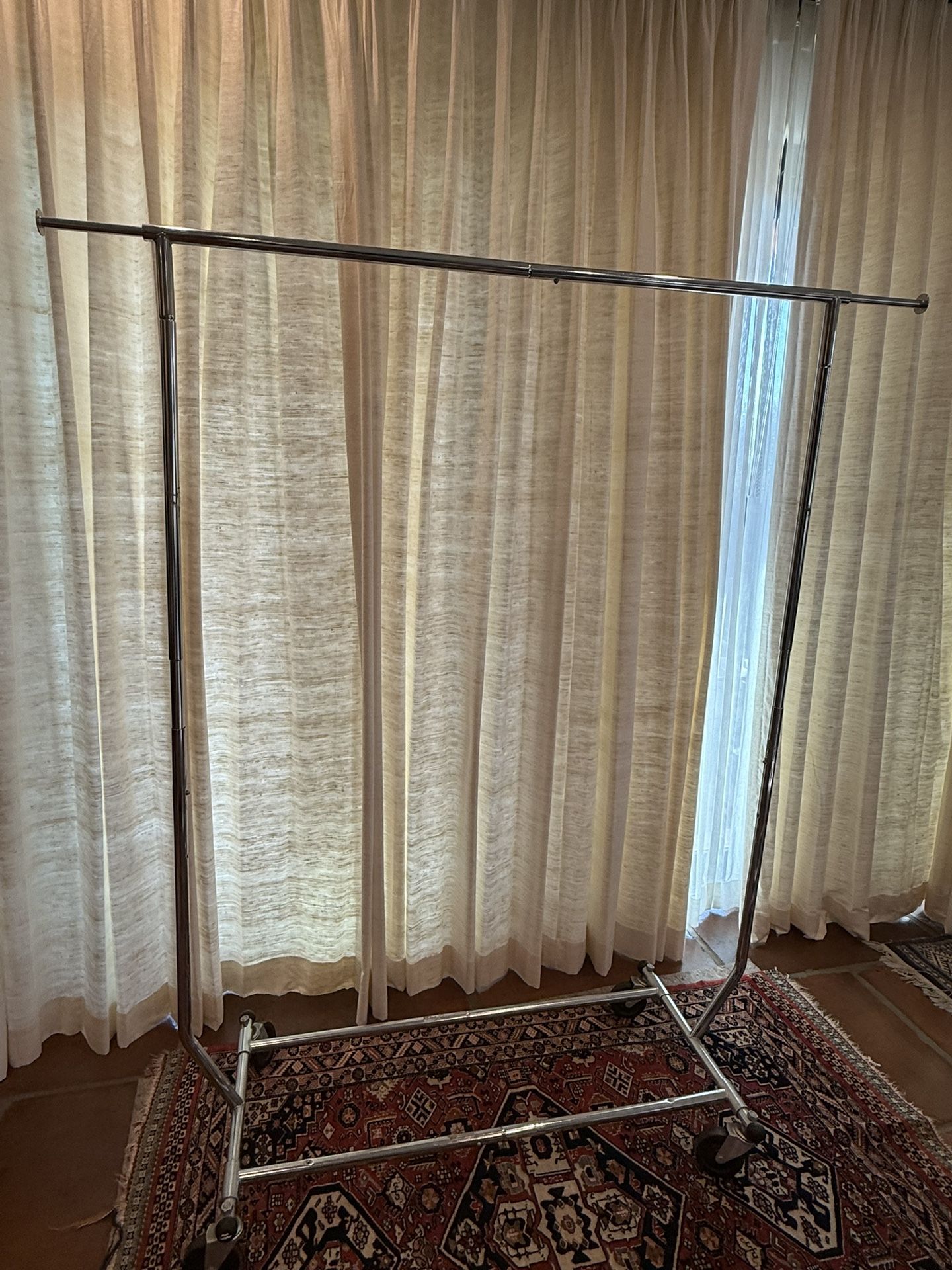 Garment Rack: Metal Frame, Rolling Clothing Storage,