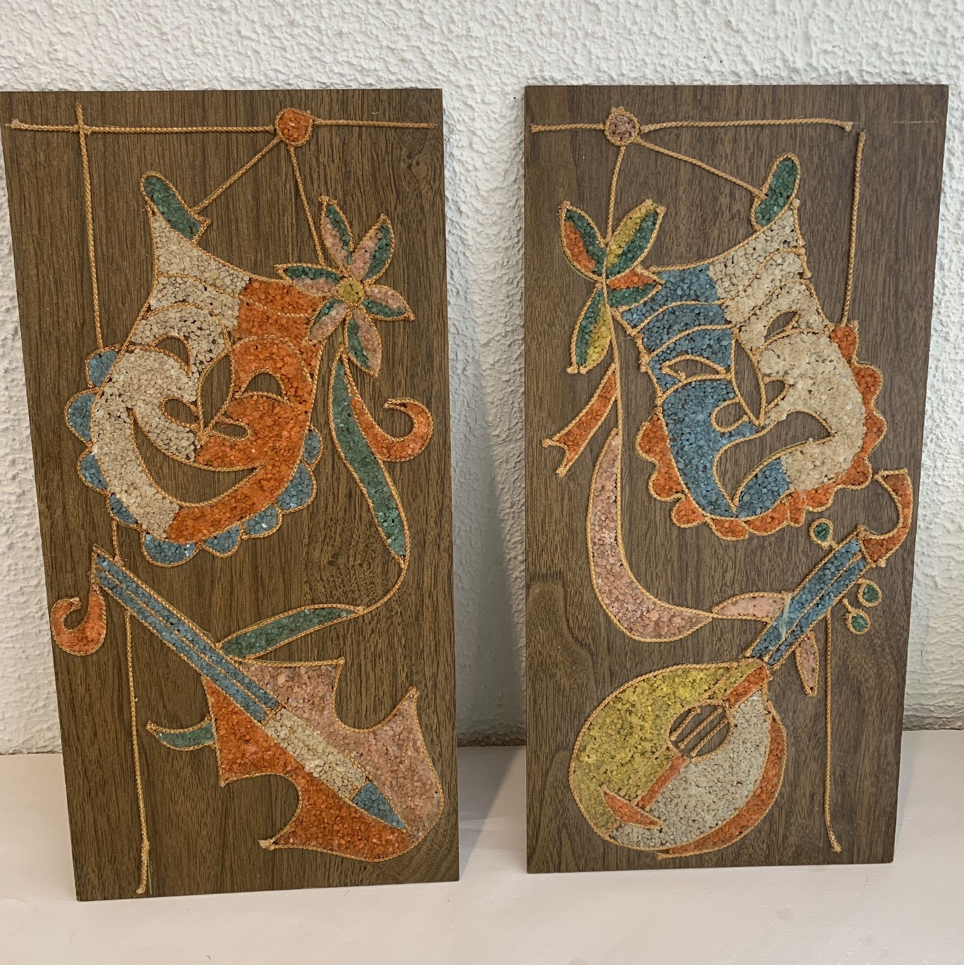 A Pair Of 60’s Gravel Art Mid Century Drama Comedy Mask 8”x16” This is a piece art , hand made ,vintage , very fine gravel mask with musical instru