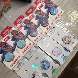 SpinPop and PopSockets brand universal phone grips and holders, Each $8