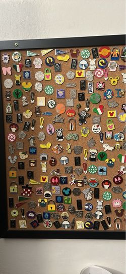 Disney Pin Assortment on Black Framed Corkboard – $475 FIRM