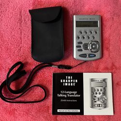 Sharper Image 12-Language Talking Translator ZE400 – Vintage Travel Companion   Embark on your next adventure with the Sharper Image ZE400 Talking Tra