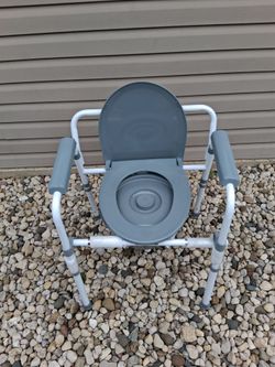 Foldable Bedside Commode!! (adjustable height) **Brand New**