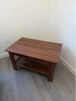 Modern Coffee Table with Storage Shelf  Clean, modern coffee table in great condition. Features a spacious tabletop with a lower shelf that’s perfect 