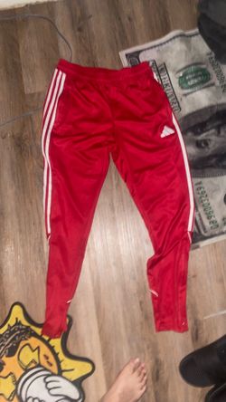 Red adidas athletic pants
