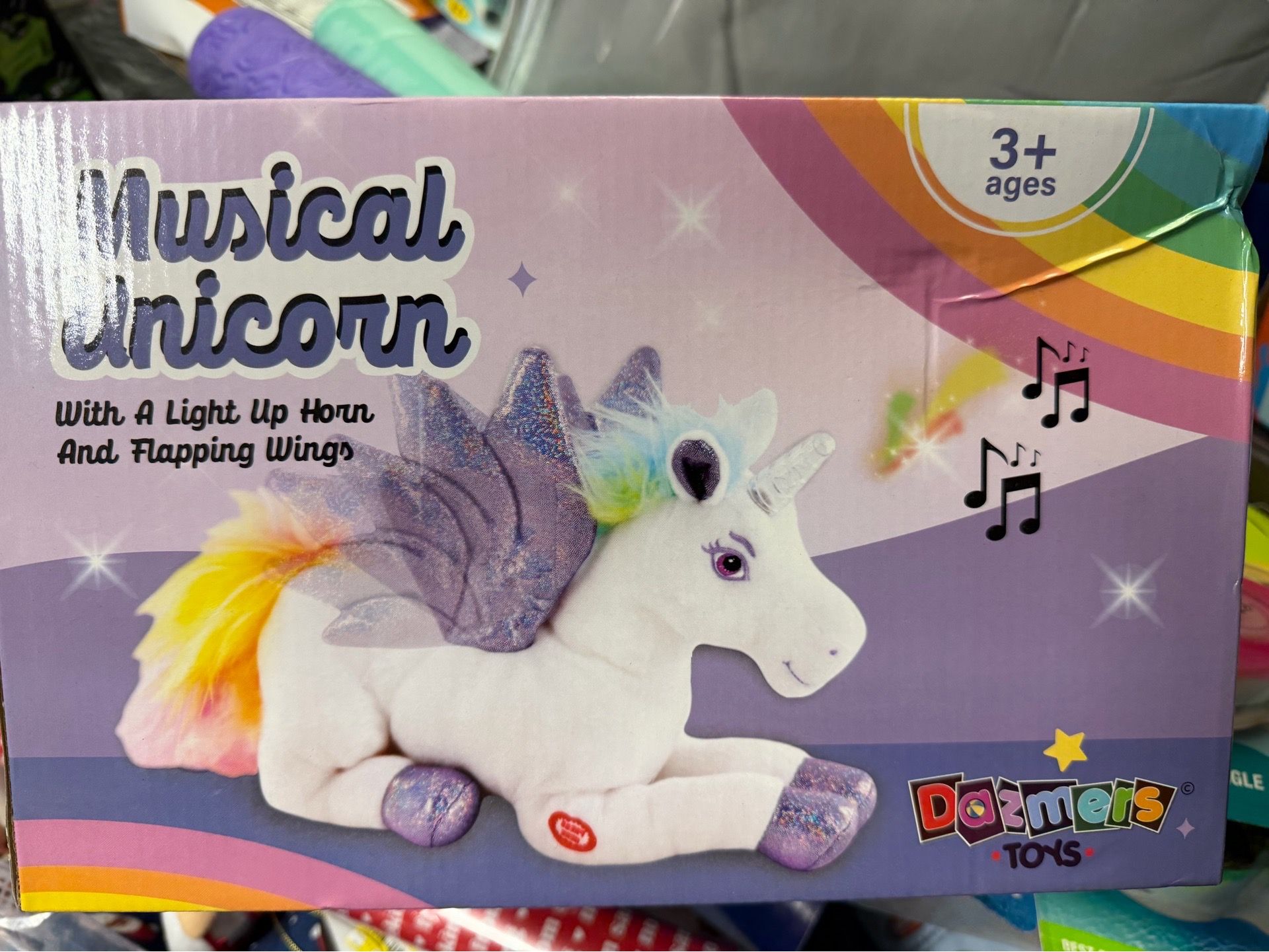 Plush white unicorn with sparkle purple wings musical
