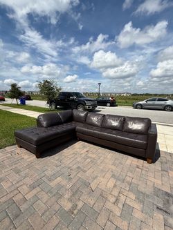Natuzzi leather sectional couch. Delivery available