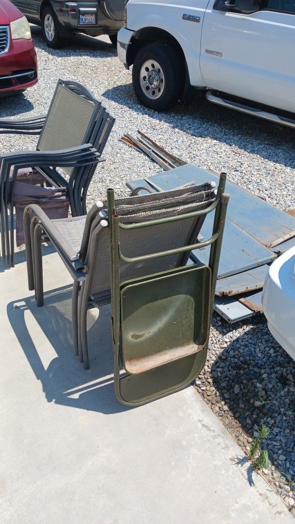 Free Junk. Metal shelving racks and ripped chairs.