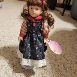 July Porcelain Doll