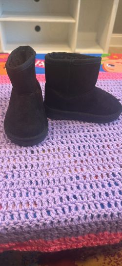 Black girl children place boots