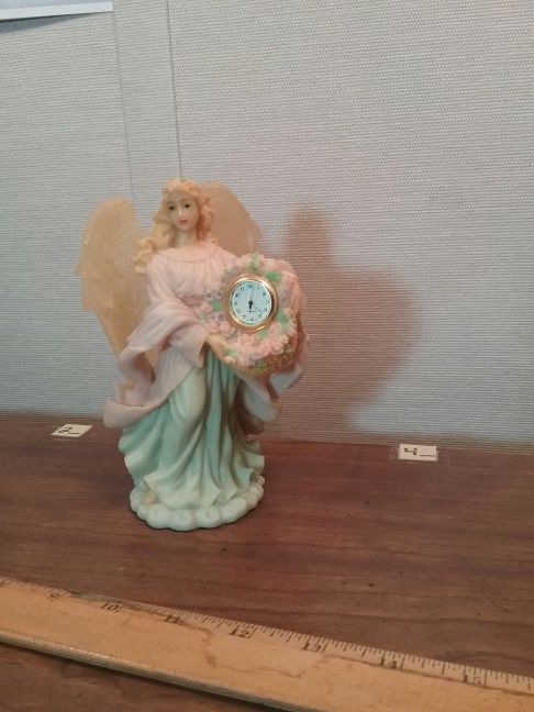 Angel with clock