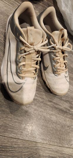 white and silver Nike Fastflex cleats,