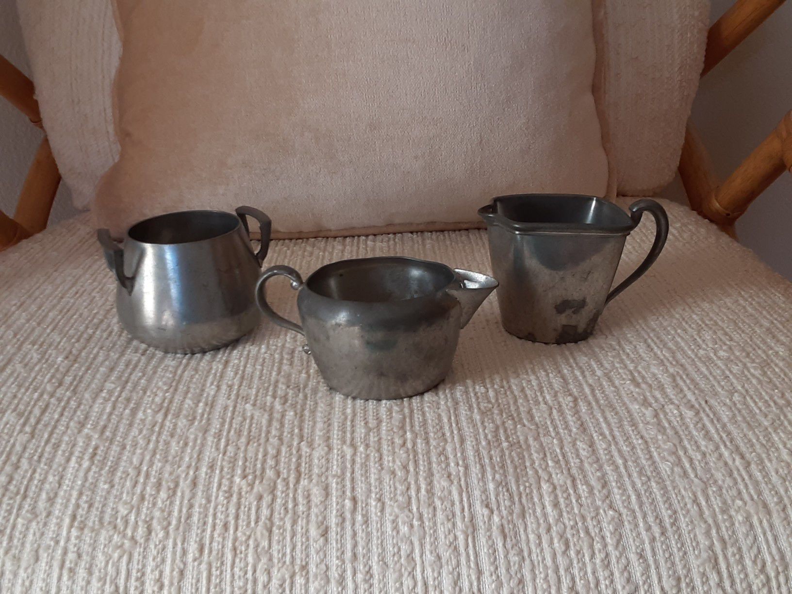 Pewter creamers and bowl