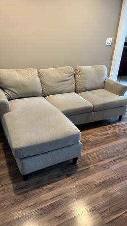 Small sofa with reversible chase