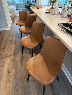 4 faux leather dining chairs