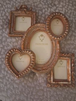 Beautiful gold guilded collage picture frame.  Never used. Very heavy and a definite heirloom piece.  Perfect Mothers Day gift.  From  bought at speci