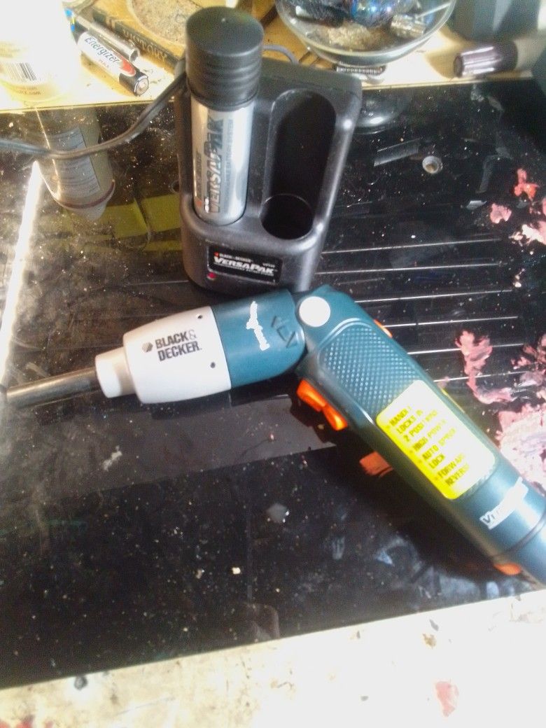 Black & Decker VersaPak cordless screwdriver with its charger and battery