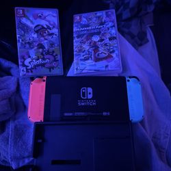 nintendo switch with games and dock
