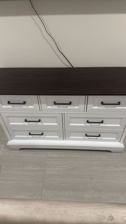 White dresser brand new never used already assembled dark top 7 drawers got done building it my wife realized she ordered the wrong one by mistake