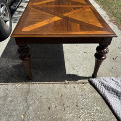 SOLID WOOD TABLE WITH CARVED LEGS AND 6  CUSHIONED CHAIRS