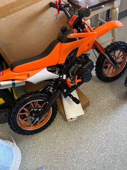 Brand new 50 cc KTM Orange dirt bikes!