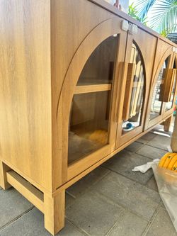 Light oak TV stand/cabinet with arched glass doors