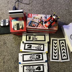 Nintendo Switch OLED Edition With White Joy Con. Includes Mario Kart Live Home Circuit.