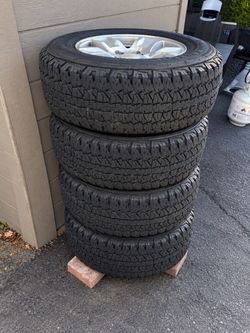 Set of 4 All-Terrain Tires on Silver Rims