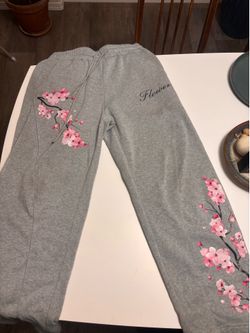 Grey sweatpants with cherry blossom design