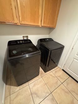 Samsung large-capacity smart top-load laundry pair.