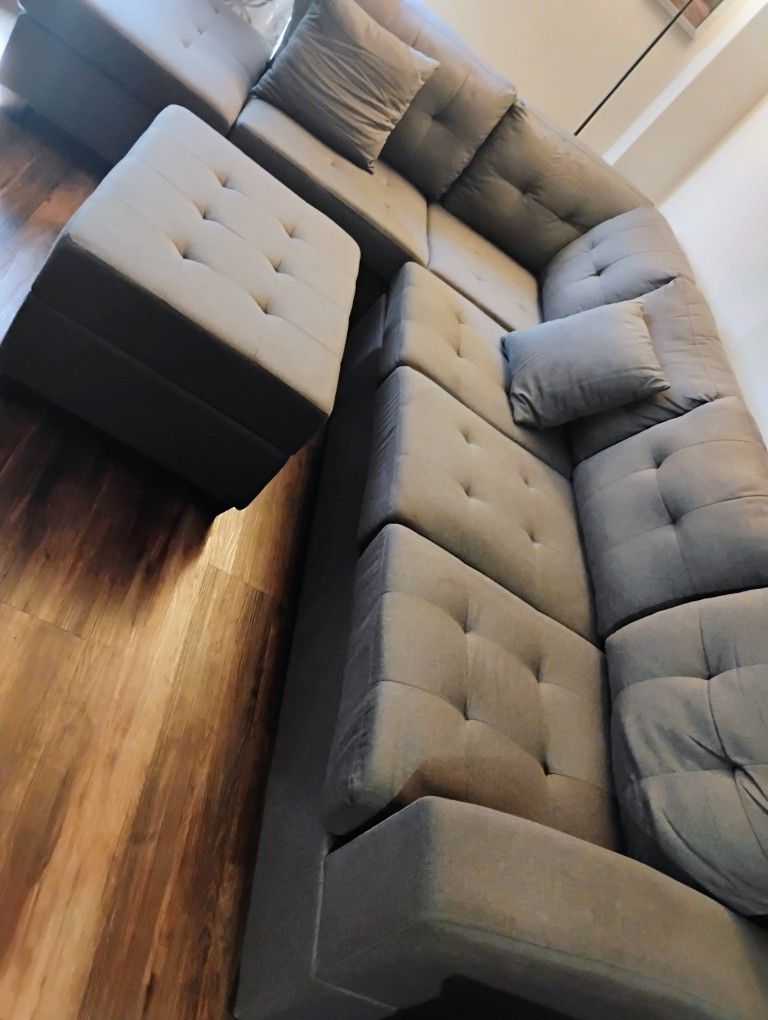 Grey Sectional Couch With Cups Holders 1 year Old Barely Used!!