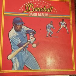 basketball and baseball cards in card album