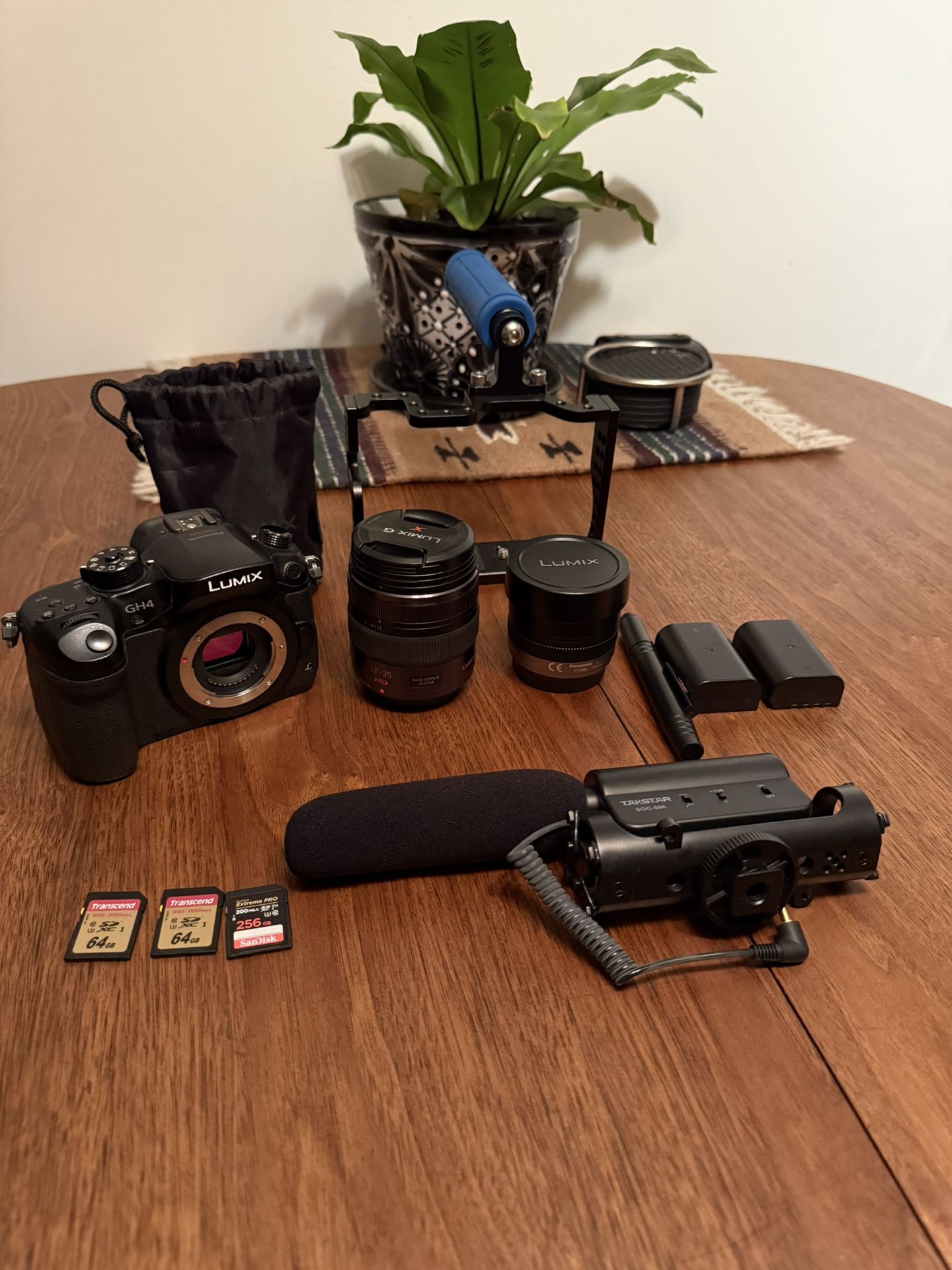 Panasonic Lumix DMC-GH4 with 2 Lens, Microphone. 3 LSD cards And a nice backpack