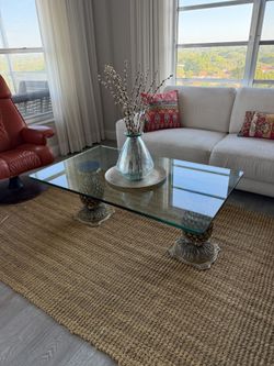 Glass top table with gold pineapples base