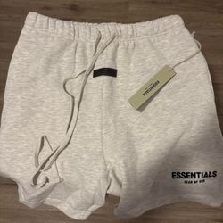 Fear of God Essentials white shorts