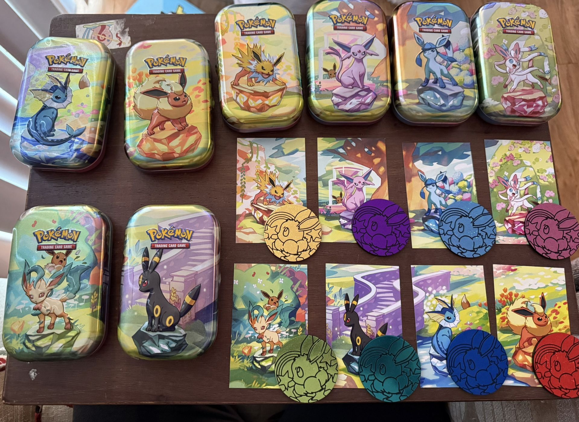8 Pokemon Tins With Art Cards, Matching Pokemon Card  And Coins 
