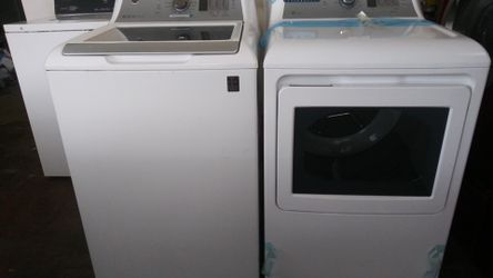 White GE top loaded washer and dyer Set. Stain removal guide washer and sensor dry dryer