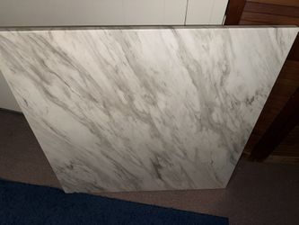 Marble tables, blue suede chairs