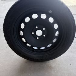 Almost new tire, trunk spare