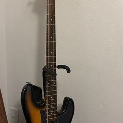 Epiphone electric bass guitar with practice speaker and sturdy stand — all included! Great starter bass package or solid backup instrument.
