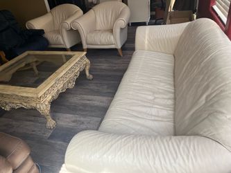 Natuzzi leather sofa set with two chairs