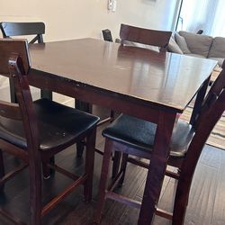 Moveout sale must Go by May 15. Wooden dining table with 4 chairs