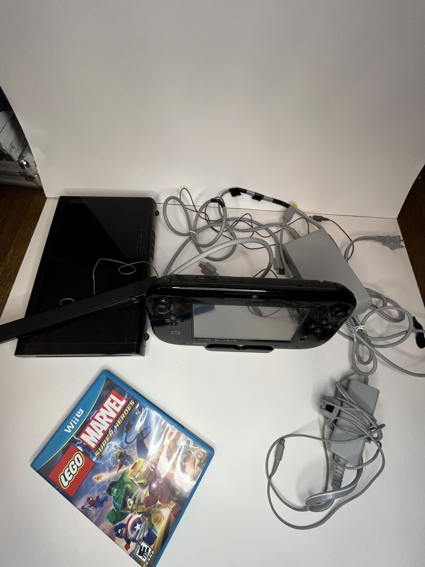 Nintendo Wii U console with game, cords, and camera
