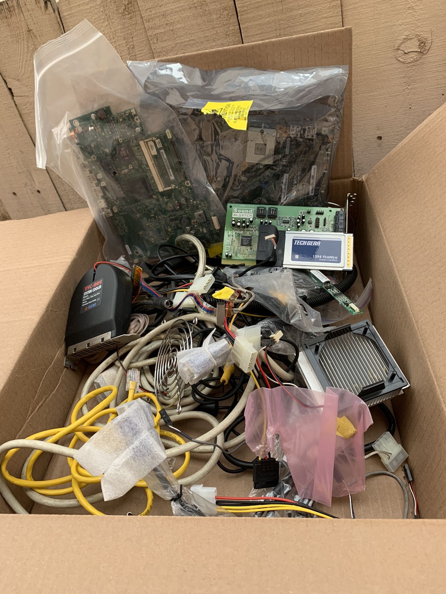 Box of cables and PC parts.