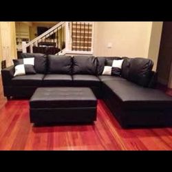 Black leather Sectional Couch And Ottoman