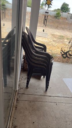 Five plastic chairs