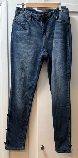 Blue Skinny Jeans with little black bows at ankle