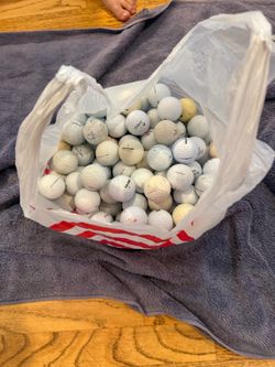 100 white golf balls