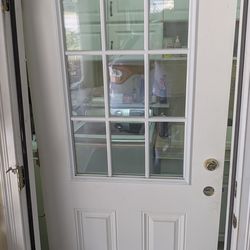 Steel clad door with 9 glass panels