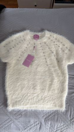 White fuzzy sweater with embedded jewels